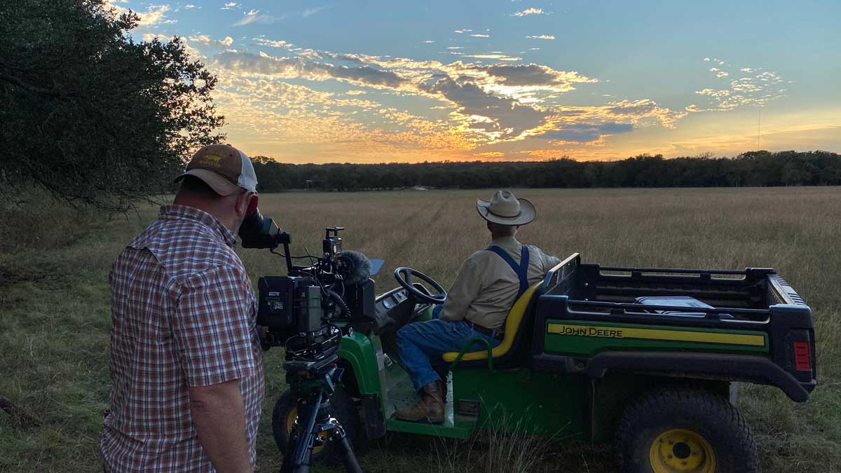 Photo of Kenneth Garret shooting Mike Colling watching a sunset at the Gault Site