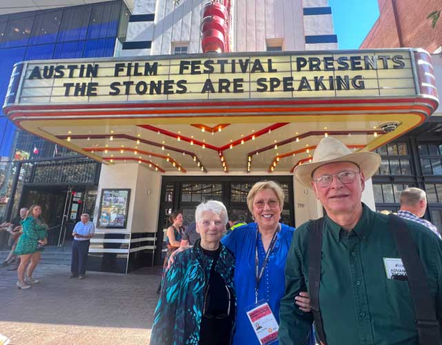 Photo of Mike Collins and Olive Talley in front of the State Theater at the Austin Film Festival premier