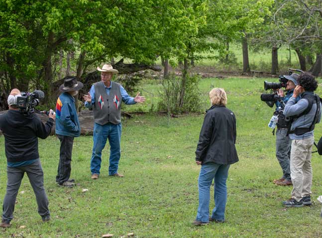 Photos of Olive directing a shoot at the Gault Site